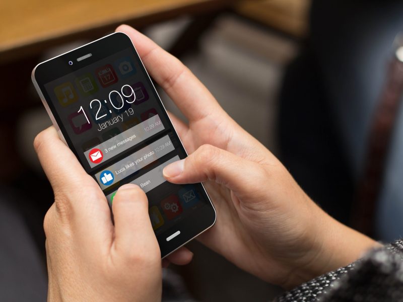 Girl using a digital generated phone with notifications on the screen.